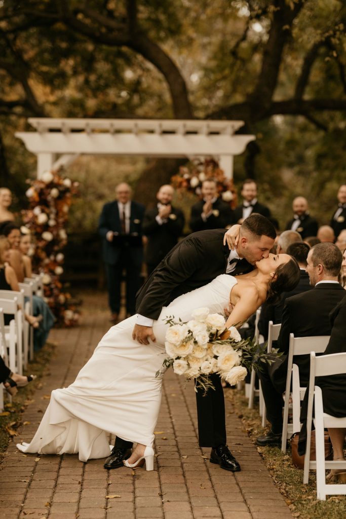 Bride and groom kissing at their wedding at the Venues at Langtree in NC.