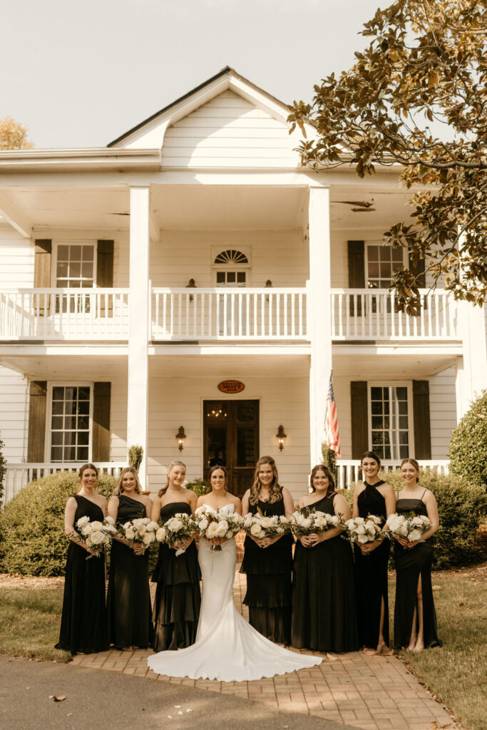 Bride and bridesmaids at her luxury wedding at Venues at Langtree in Mooresville NC by Crafted Charm Wedding Planning