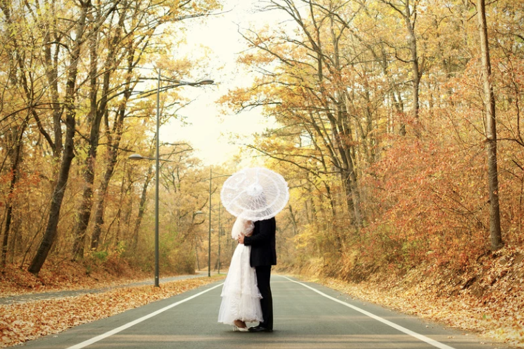 fall wedding bride and groom portrait- fall foliage backdrop