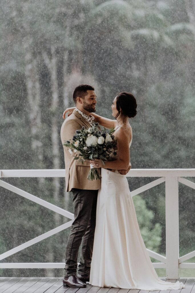 fall rainy weather wedding plan- bride and groom portrait