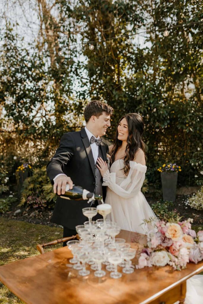 Champagne Tower Toast at Separk Mansion Luxury Southern Garden Spring Wedding in North Carolina by Crafted Charm Wedding Planning