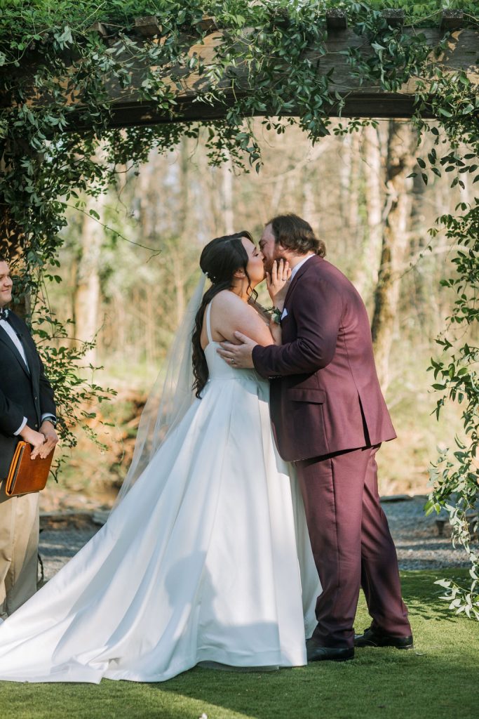 Cottagecore wedding- Historic Robertson Homestead- Rock Hill, SC- garden ceremony- bride and groom kiss