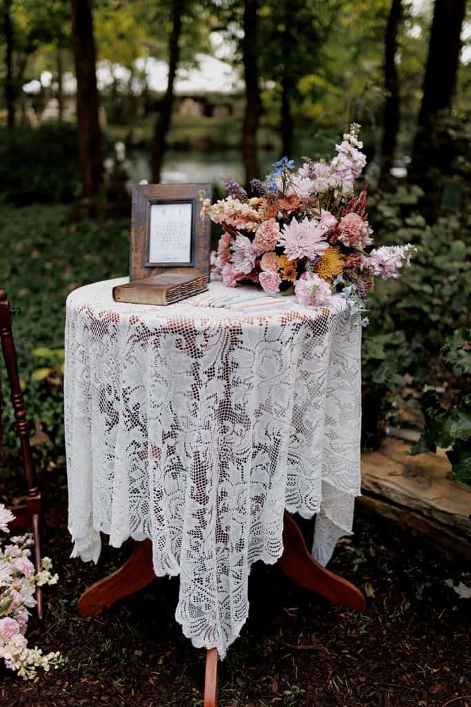 Colorful floral wedding ceremony setup in Rock Hill, SC, designed by Crafted Charm Wedding Planning, featuring vibrant blooms and elegant decor