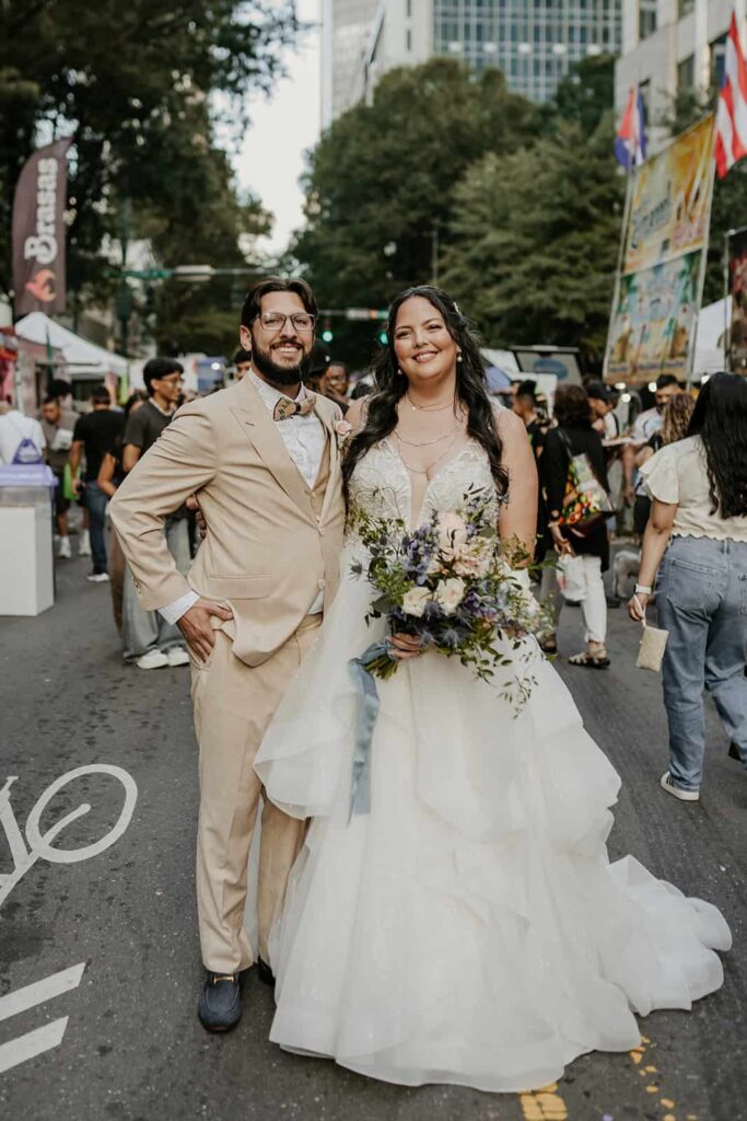 bride and groom portraits- wedding with navy, sage and blush in uptown Charlotte, nc at the mint museum uptown with an art deco wedding style