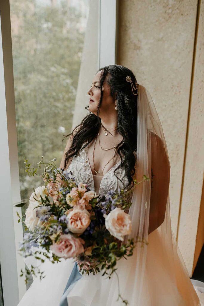 bride portraits- wedding with navy, sage and blush in uptown Charlotte, nc at the mint museum uptown with an art deco wedding style