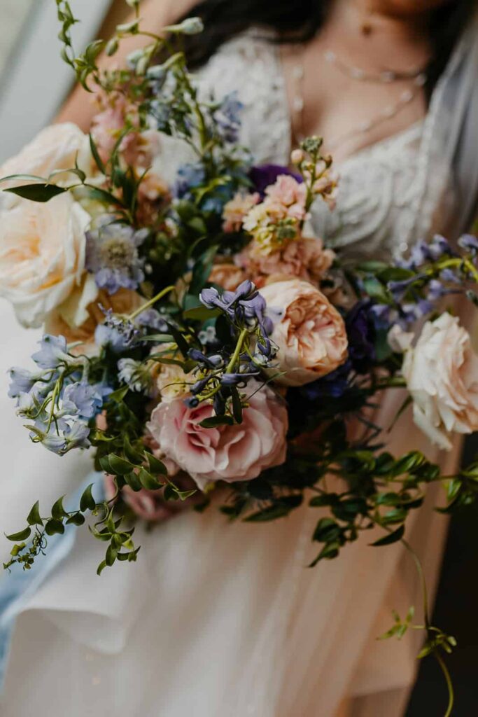 bride portraits- wedding with navy, sage and blush in uptown Charlotte, nc at the mint museum uptown with an art deco wedding style