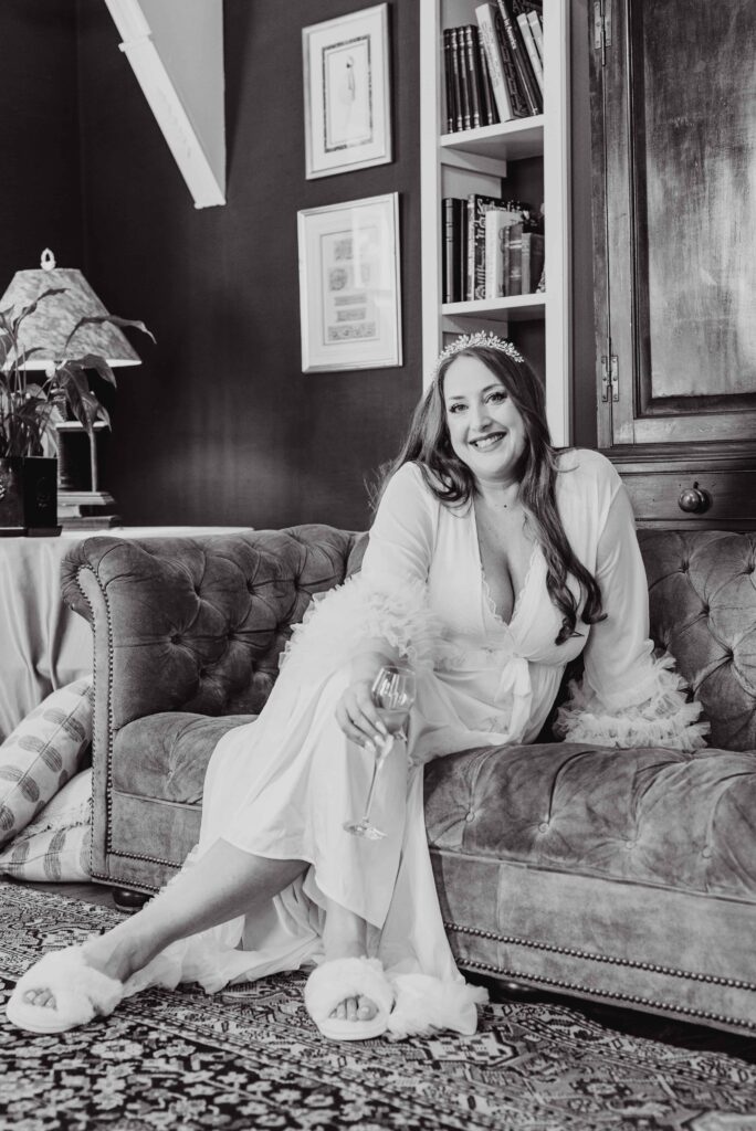bridal portrait sitting on settee at the Morehead inn in Charlotte nc at a luxury estate wedding