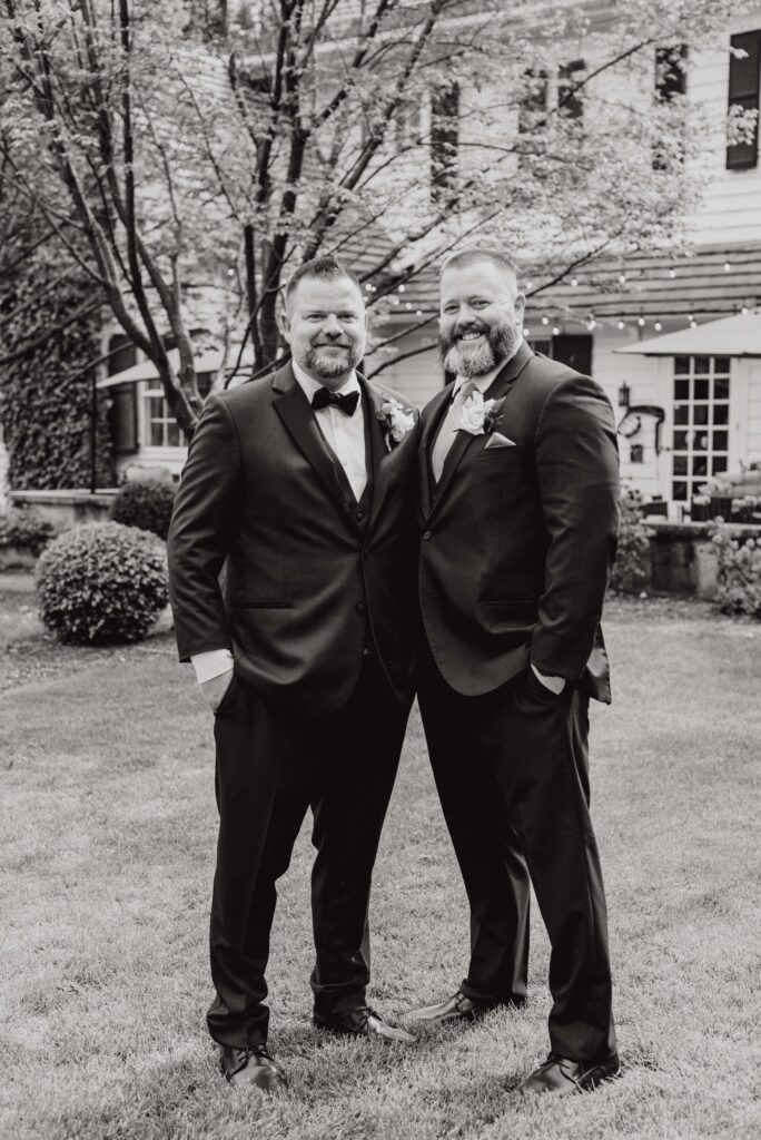 groom portrait with best man at the Morehead inn in Charlotte nc at a luxury estate wedding