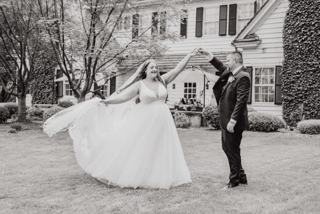 bride and groom dancing outside the Morehead inn in Charlotte nc at a luxury estate wedding