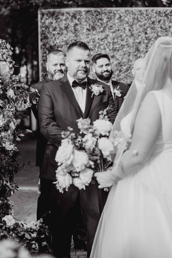 bride and groom at altar at the Morehead inn in Charlotte nc at a luxury estate wedding
