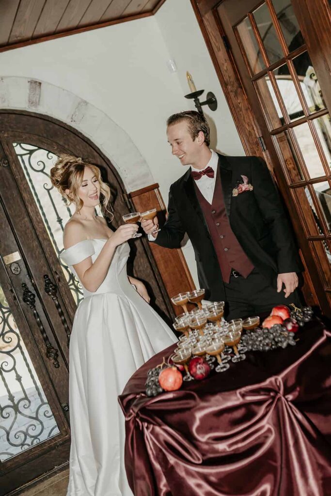 Sunset Ridge Estate luxury southern wedding venue in Monroe NC with bride and groom toasting at large estate for newlywed portraits