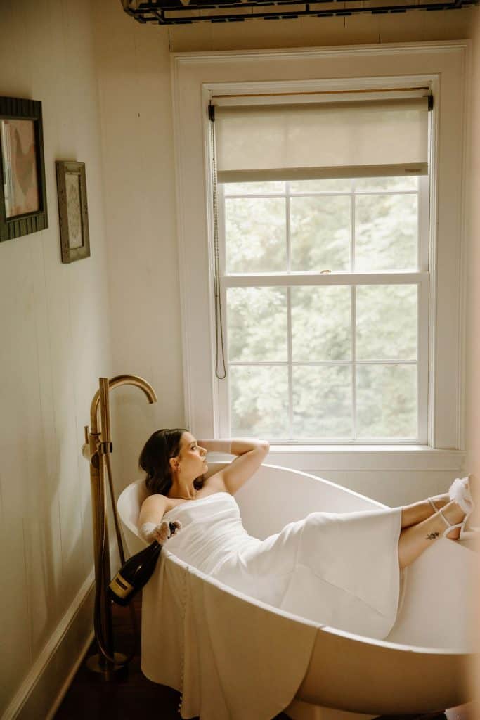 bride portrait laying in a tub at the Historic Robertson Homestead in Rock Hill, SC