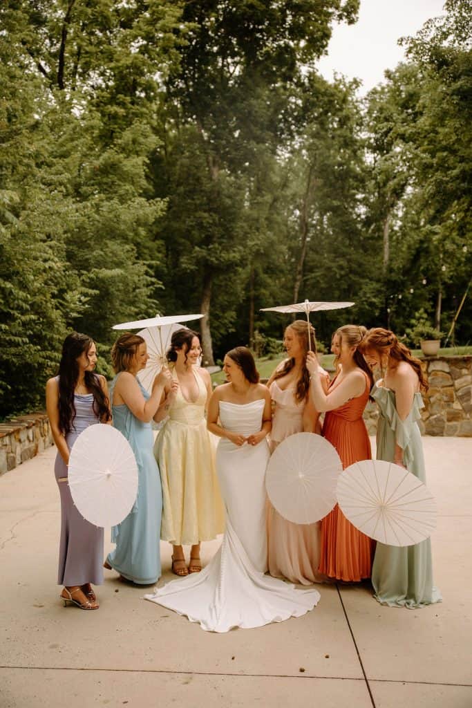 bride and bridesmaid portrait carrying parasols at the Historic Robertson Homestead in Rock Hill, SC