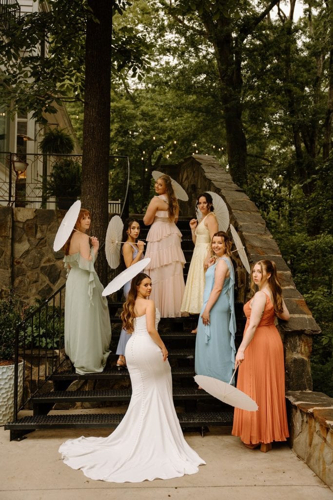 bride and bridesmaid portrait carrying parasols at the Historic Robertson Homestead in Rock Hill, SC