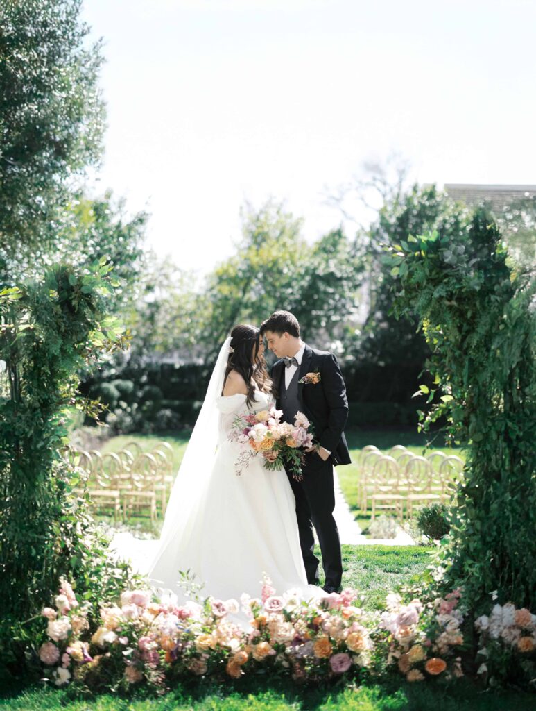 Luxury Spring Color Southern Wedding at Separk Mansion in Gastonia NC by Crafted Charm- outdoor ceremony with arch and floral meadow