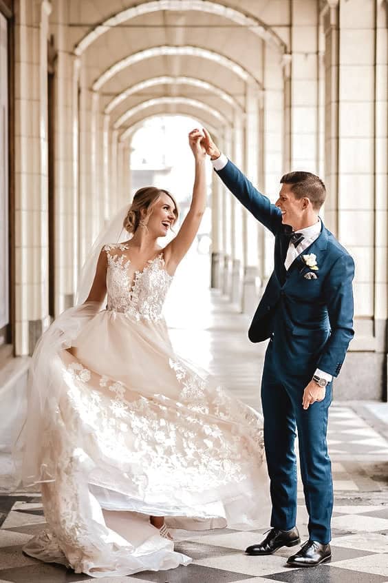Bride and groom spinning at luxury wedding estate