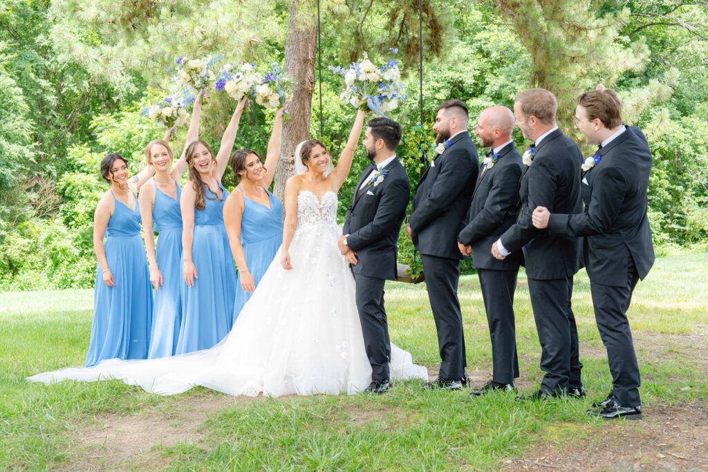 Bride and Groom and bridal party at The Rafters at Historic St. Mark in Huntersville, NC at a classic blue and white styled wedding.