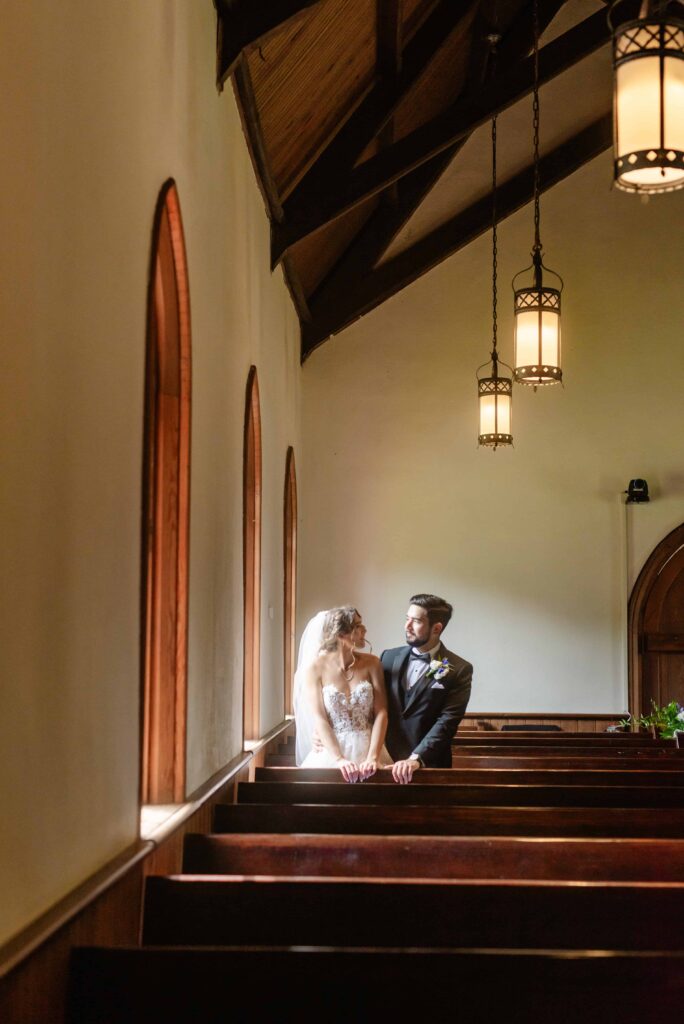 Bride and Groom and bridal party at The Rafters at Historic St. Mark in Huntersville, NC at a classic blue and white styled wedding.