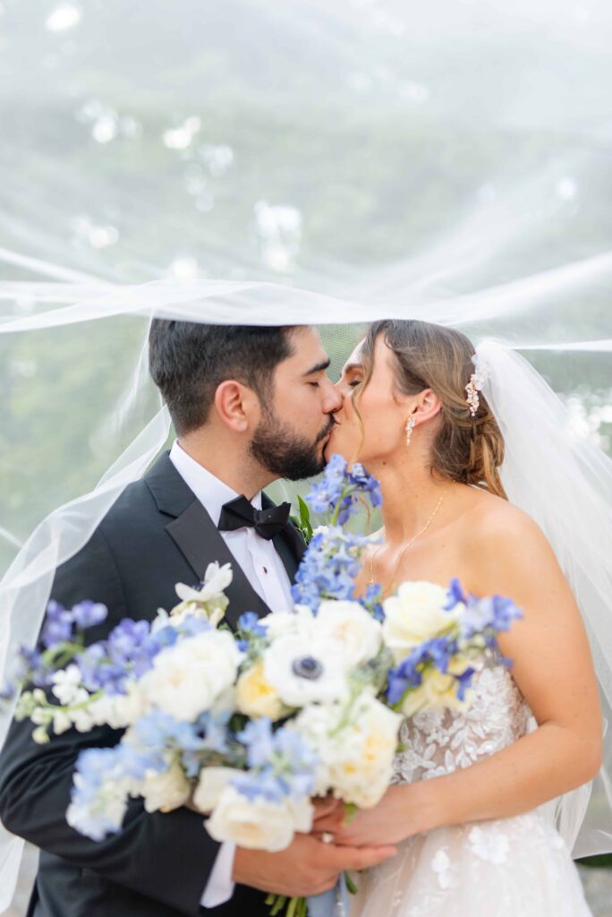 bride and Groom portrait at The Rafters at Historic St. Mark in Huntersville, NC at a classic blue and white styled wedding.