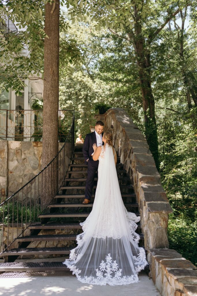 bride and groom portraits at historic Robertson homestead in rock hill SC at a classic white and green styled wedding in a natural setting and historic estate