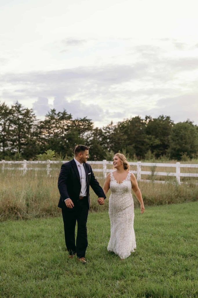 bride and groom portraits at historic Robertson homestead in rock hill SC at a classic white and green styled wedding in a natural setting and historic estate