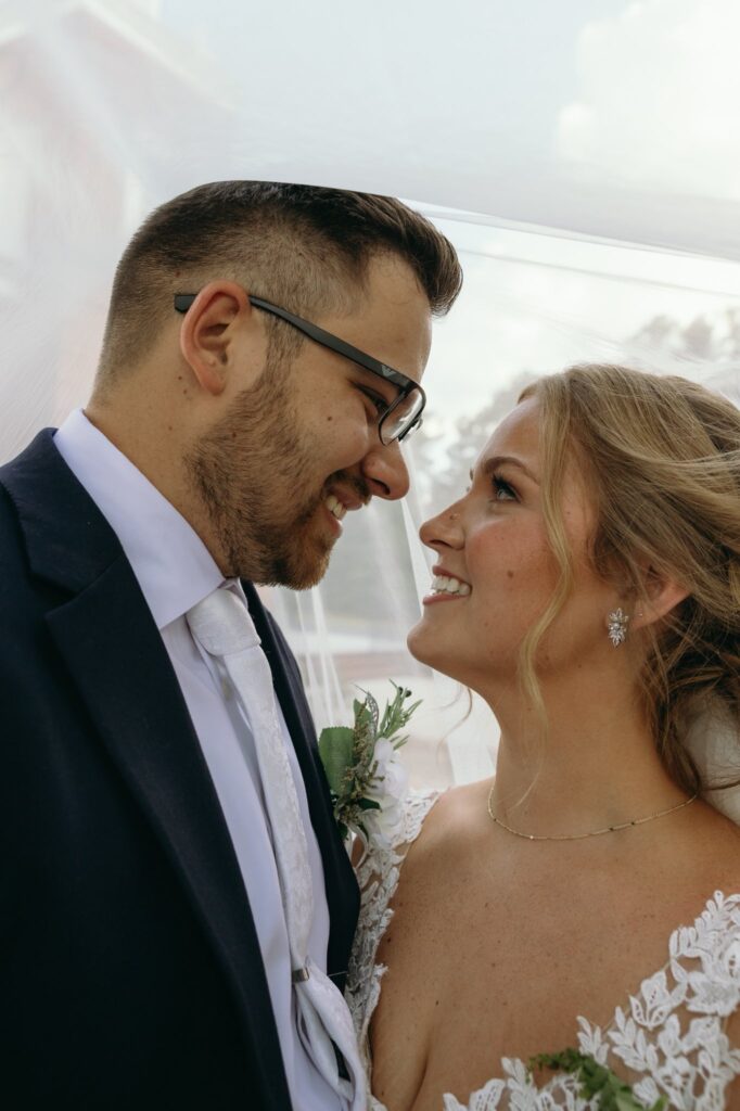 bride and groom portraits at historic Robertson homestead in rock hill SC at a classic white and green styled wedding in a natural setting and historic estate