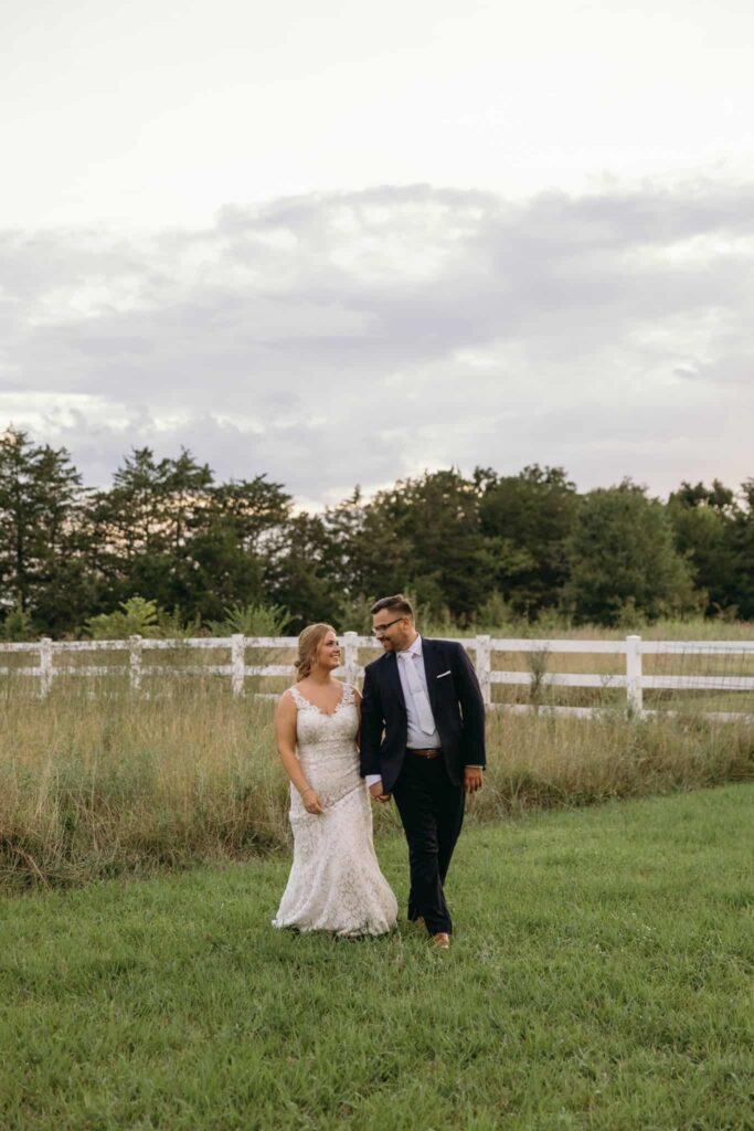 bride and groom portraits at historic Robertson homestead in rock hill SC at a classic white and green styled wedding in a natural setting and historic estate