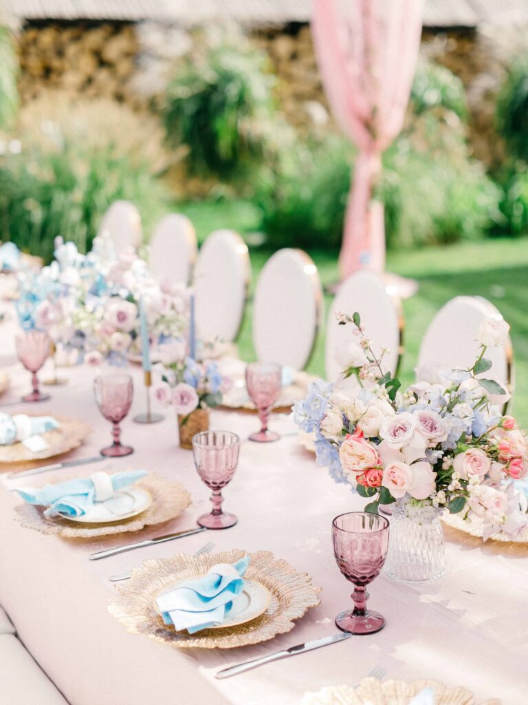 pastel spring colors- wedding reception tablescape- pink glassware, gold chargers