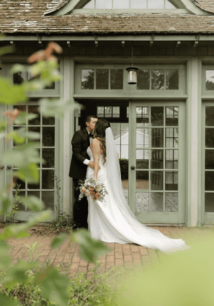 Bride and Groom Portrait Kissing doing spring wedding in Charlotte NC at VanLandingham Estate