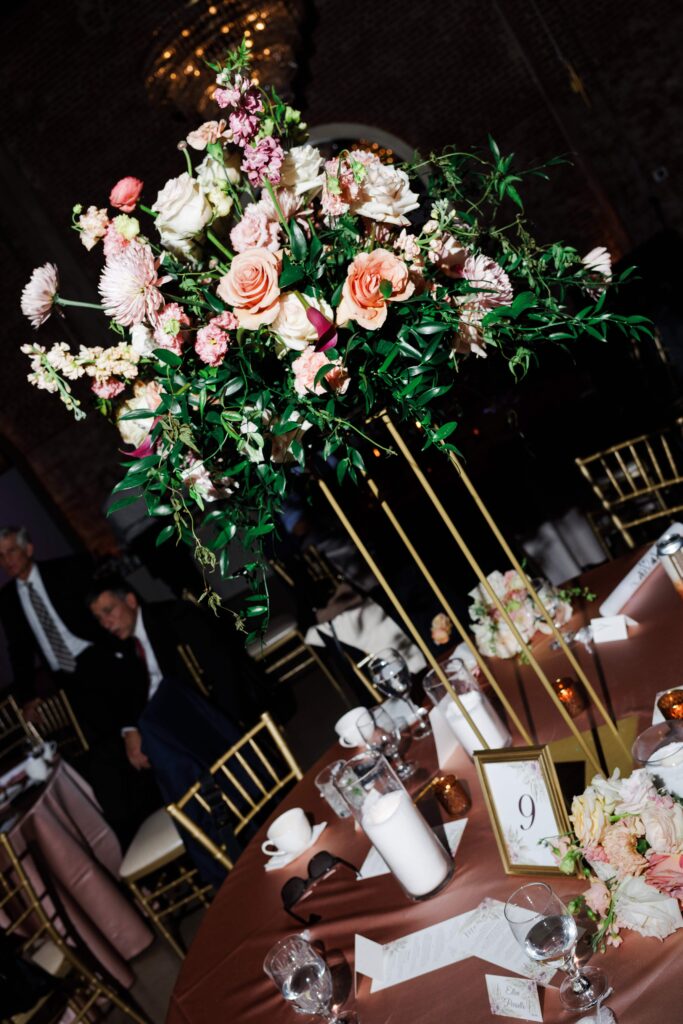 The Revelry Charlotte NC wedding venue decorated in luxury florals with gold and soft pink accents by Crafted Charm Florals