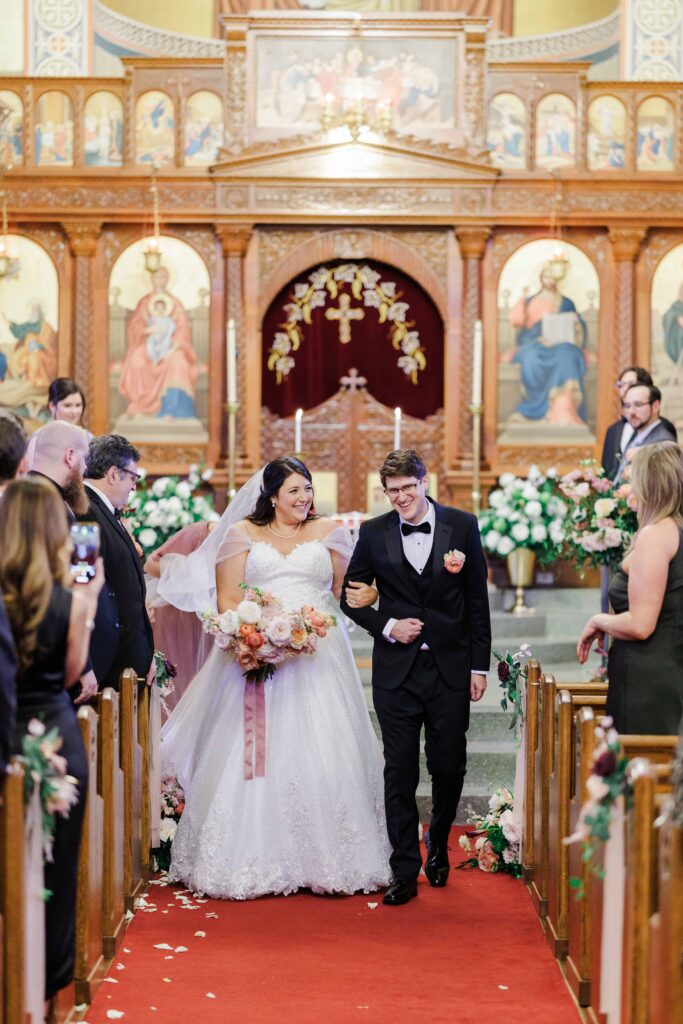 The Holy Trinity Orthodox Cathedral wedding ceremony venue in Charlotte NC, bride and groom recessional