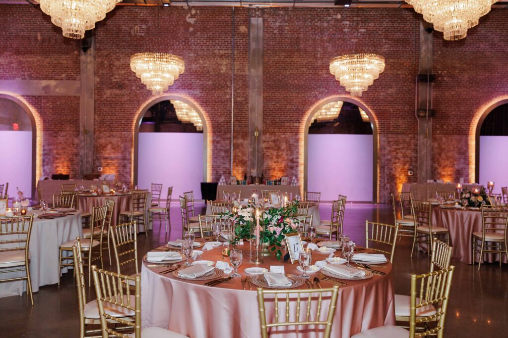 The Revelry Charlotte NC wedding venue decorated in luxury florals with gold and soft pink accents by Crafted Charm Florals