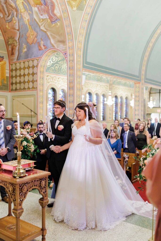 The Holy Trinity Orthodox Cathedral wedding ceremony venue in Charlotte NC, bride and groom during ceremony